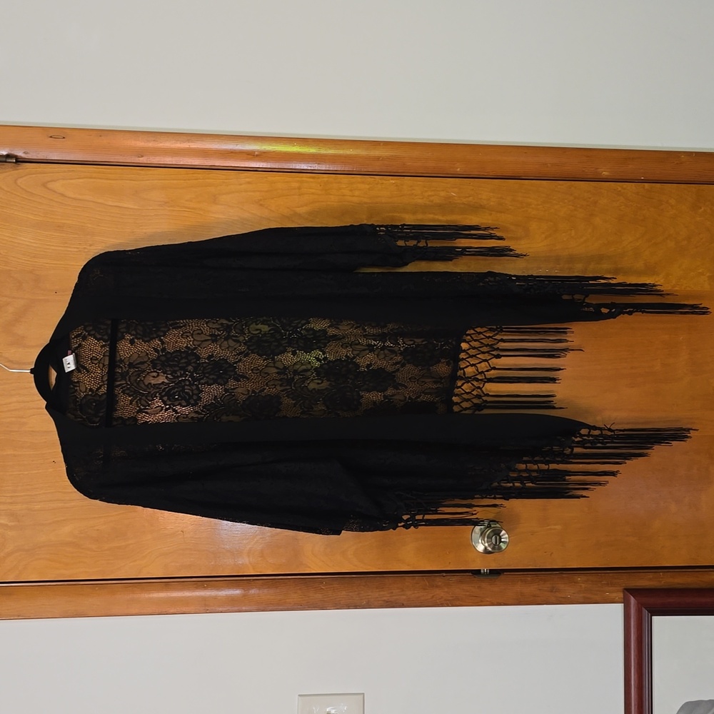 Black lace fringe, sleeved shawl.